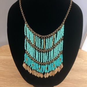 Turquoise, gold and bronze statement necklace brand unknown.